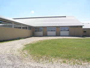 Gray industrial overhead door with windows Agriculture